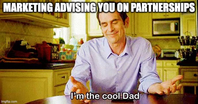 A meme of a nerdy dad who thinks he's cool. A satirical caption stating: marketing advising you on partnerships is like a dad saying, "I'm the cool dad".